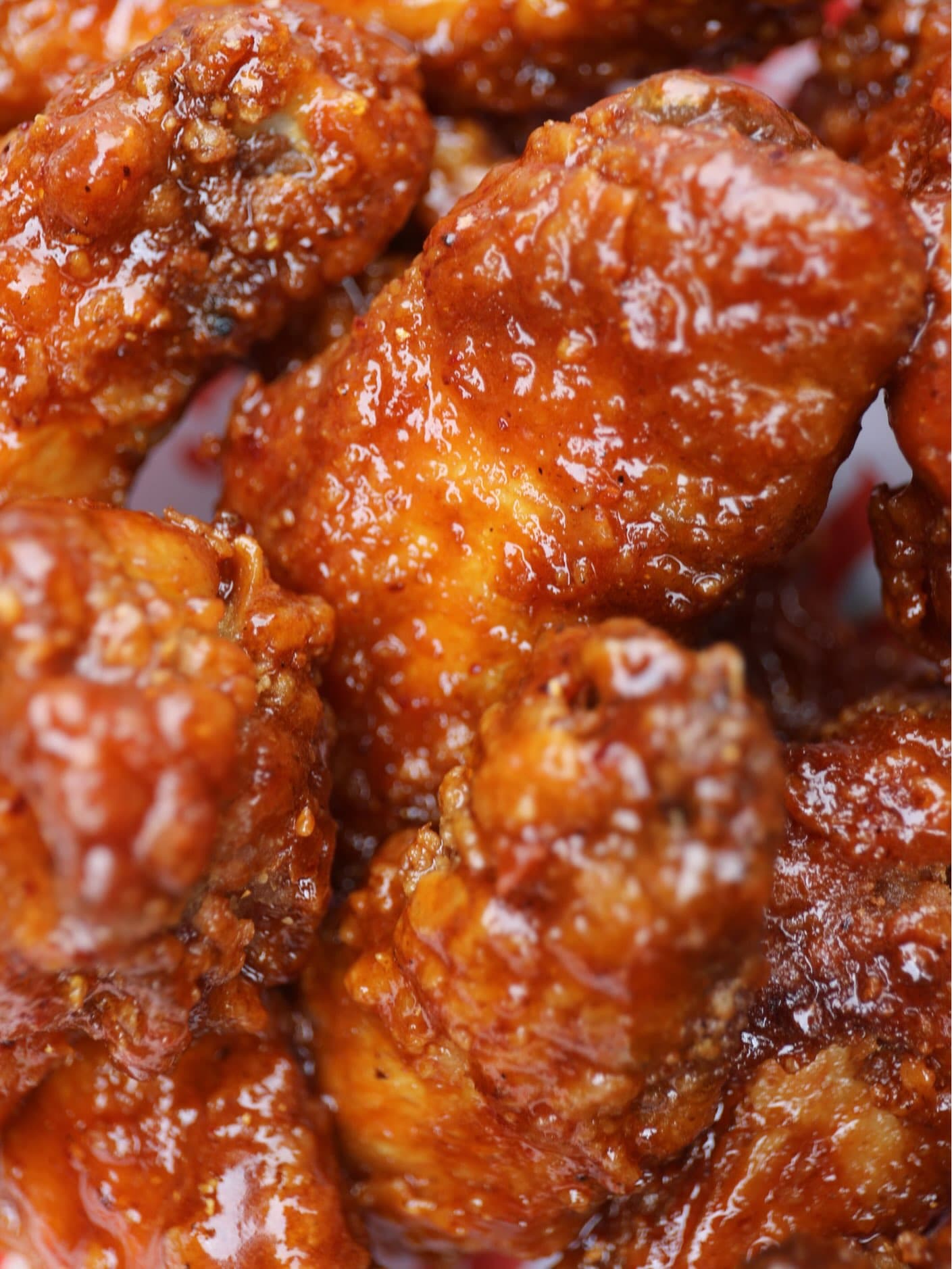 Sauced wings on branded paper